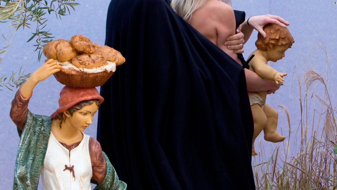 Topless protester tries to grab baby Jesus figure at Vatican