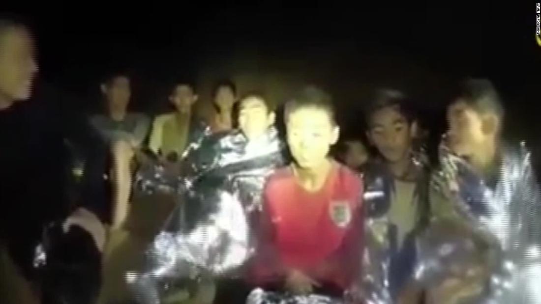 Rescuers face race against time to free trapped boys as one former Thai Navy diver dies inside cave