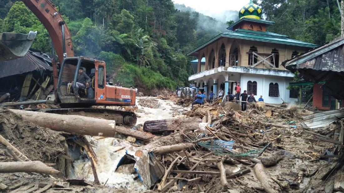 20 people killed when flooding wipes out part of school in Indonesia